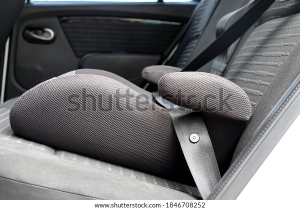 Safety booster\
seat for children. Car\
interior.