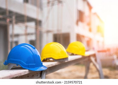 Safety Construction Worker Hats Blue, yellow, orange. Teamwork of construction team must have quality. Whether it engineer, construction workers. Have a helmet to wear at work. - Shutterstock ID 2159570721