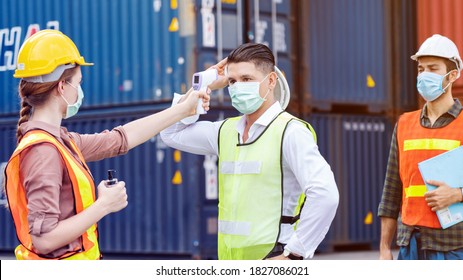 Safety Of Engineer Team Or Construction Have A Hard Hat, Body Temperature Monitor To Healthy Work And Mask In Factory Or Container. Prevent Accident Work Or Dust And Coronavirus. Concept New Normal