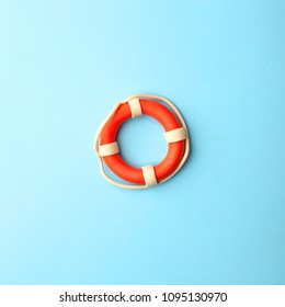 Safety equipment, life buoy or rescue buoy on blue background, minimal summer concept