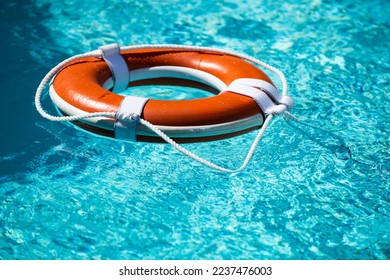 Safety equipment, Life buoy or rescue buoy floating on sea to rescue. Help in water concept.