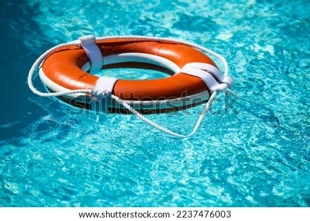 Safety equipment, Life buoy or rescue buoy floating on sea to rescue. Help in water concept.