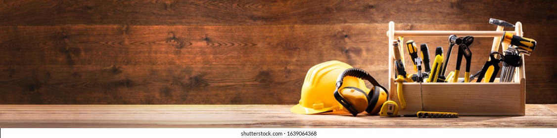 Safety Equipment's Near Toolbox With Various Work Tools On Wooden Surface - Shutterstock ID 1639064368