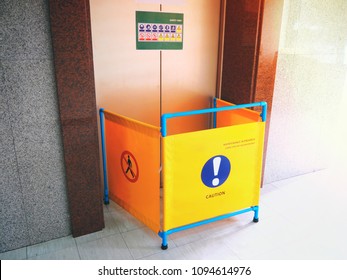 The Safety First Concept, Blocking Space By Technicians For Repair And Maintenance Of Elevator Passenger. Can See Caution And Don't Pass Sign , And Label Of Many Sign Of Safety On Elevator Door