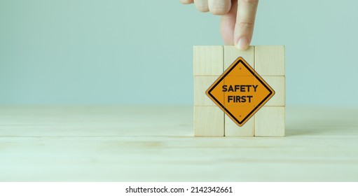 Safety First Symbols, Work Safety, Caution Work Hazards, Danger Surveillance, Zero Accident Concept. Wooden Cubes With Smart Grey Background. Employees Safety Awareness At Workplace. Safety Banner.