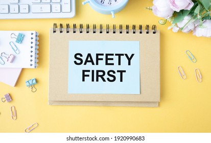 Safety first text concept write on notebook