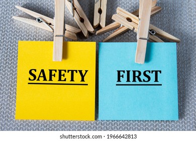 SAFETY FIRST - Words On Multicolored Writing Paper On Gray Background With Clothespins. Education Concept