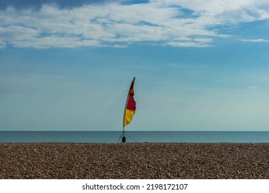 Safety Flag On  A Shingle Beach