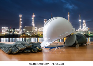 Safety in functions, safety standard set on working table. safety of workers on the background oil refinery. Always wear safety equipment and personal protective equipment. 