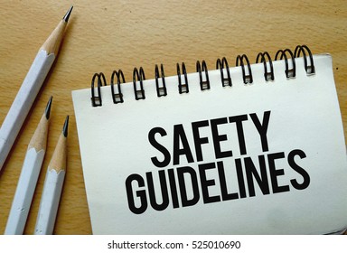 Safety Guidelines Text Written On A Notebook With Pencils