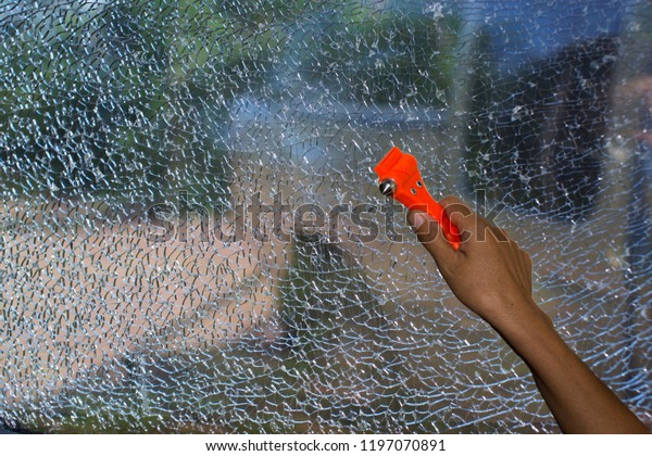 Safety Hammer  in\
Cars and Glass breakage, broken window,Concept for Safety and\
emergency  and burglary.