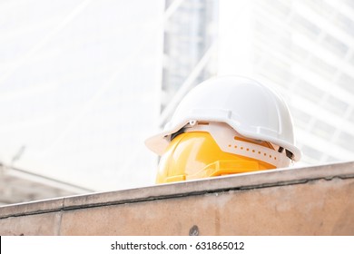Safety hats with building background - Shutterstock ID 631865012