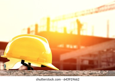 safety helmet at construction site with crane background - Shutterstock ID 643919662