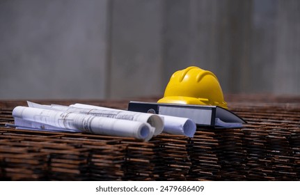 Safety helmet engineer, blueprint and document file  is engineer architect work equipment with estate construction site background. - Powered by Shutterstock