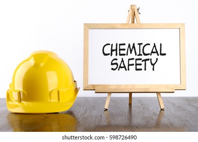 Safety Helmet And White Board With Words Chemical Safety,Health And Safety Concept.