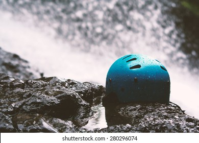 Safety helmets used for adventure sport with waterfall background.Use film filter. - Powered by Shutterstock