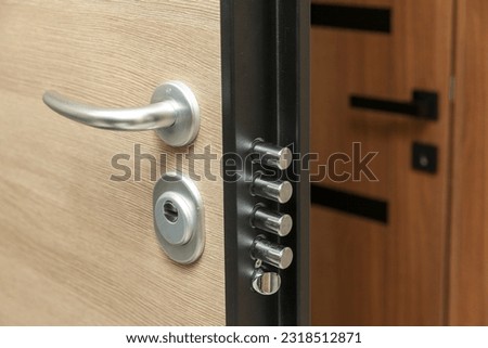 Safety lock on the safety door, metal handle, close up
