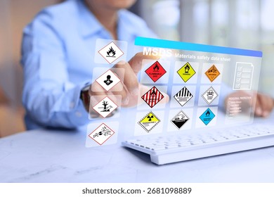 safety materials data sheet concept with factory manager prepare the information on computer virtual screen to worker information when working with dangerous substance in hazard material storage area