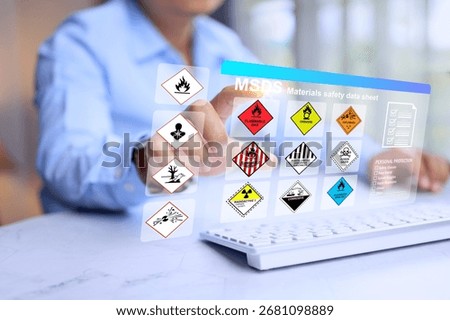 safety materials data sheet concept with factory manager prepare the information on computer virtual screen to worker information when working with dangerous substance in hazard material storage area