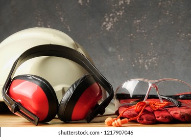 Safety Personal Protective Equipment(PPE) On A Rustic Black Background.