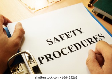 Safety Procedures In A Blue Folder. Work Safety Concept.