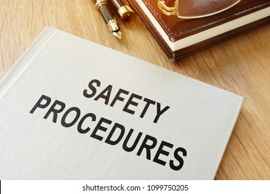 Safety Procedures Manual On An Office Desk.