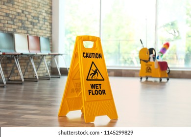 Safety Sign With Phrase Caution Wet Floor, Indoors