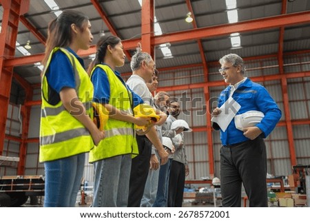 Safety training session for construction workers warehouse group meeting indoor eye-level professional development