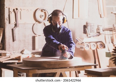 Safety In Woodworking. Female Carpenter In Googles And Dust Mask