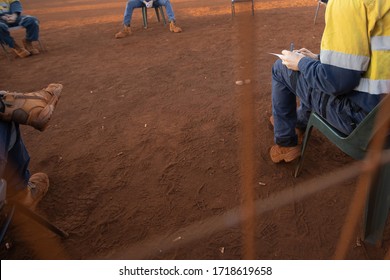 Safety Workplace Clear Pic Of Construction Worker Setting On The Chair Maintains 1.5 Metre Social Distancing Prevention Of Coronavirus -19 During Prestating, Signing Off Paperwork Risk Assessment 