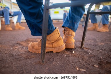 Safety Workplace Clear Pic Of Worker Safety Boot Setting On The Chair Maintains 1.5 Metre Or 6 Feets Social Distancing Prevention Of Coronavirus -19 During Prestating Morning Shift 