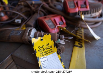 Safety Workplaces Yellow Out Of Service Tag Attached On Faulty Damage  Metal Die Grinder Power Tools  Construction Site Perth, Australia