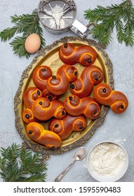 Saffron Raisin Buns On A Bronze Tray. Traditional Swedish Christmas Food. Top View, Flat Lay.