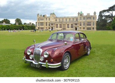 SAFFRON WALDEN, ESSEX, ENGLAND - JUNE 21, 2015: Classic Red Daimler 250 V8 on show at Audley End House