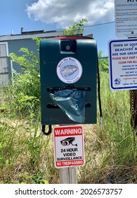 Sag Harbor, NY, USA, 7.24.21 - Signs Posted From The Town Of Southampton Listing The Rules And Regulations Of Foster Memorial Beach. There Are Also Free Baggies Provided For Dog Poor And Bathrooms.