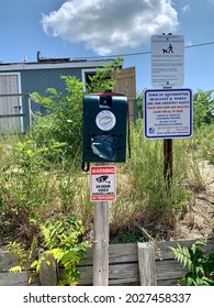 Sag Harbor, NY, USA, 7.24.21 - Signs Posted From The Town Of Southampton Listing The Rules And Regulations Of Foster Memorial Beach. There Are Also Free Baggies Provided For Dog Poor And Bathrooms.