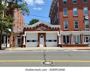 Sag Harbor, NY, USA, 8.6.21 - The Exterior Of The Sag Harbor Fire Department Located In Town. The Historical Building Is Made Of Bricks And Has Two Garage Doors For The Fire Trucks To Come And Go.