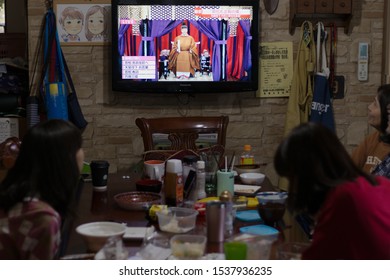 Sagae, Yamagata/Japan - October 22, 2019: A Japanese Family Watches The Enthronement Of The Japanese Emperor Live On T.V. While Having Lunch.