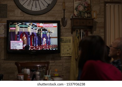 Sagae, Yamagata/Japan - October 22, 2019: A Japanese Family Watches The Enthronement Of The Japanese Emperor Live On T.V. While Having Lunch.