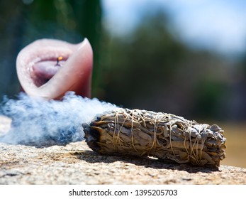 Sage Burning With A Candle Outdoors