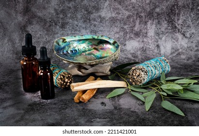 Sage, Palo Santo And Abalone In Front Of Gray Background