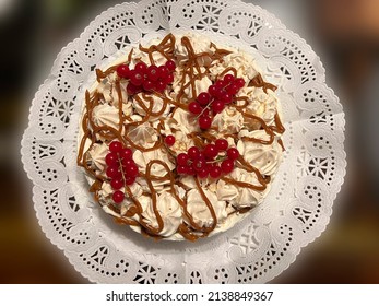 Sagittal Plane Of A Meringue, Cream And Caramel Cake With Red Currant