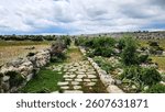 In Saglikli, Tarsus, Mersin, a view of the ancient Roman road which is 3 m wide and 3 km long. Curbstones are still intact, showcasing its historical significance.