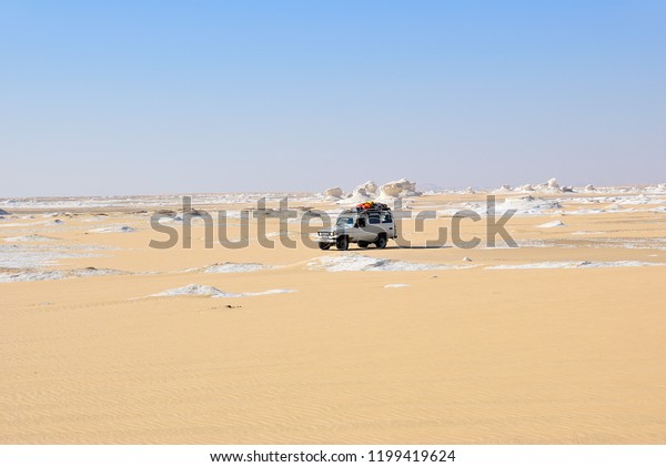 Sahara, Egypt - December 27, 2008: Offroad car\
shown in the White desert. Extreme desert safari is one of the main\
local tourist attraction in\
Egypt