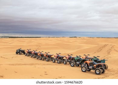 SAHARA, TUNIS - MAY 26, 2019: Caravan Of Quad Bikes Standing At Sandy Sahara Desert In Africa. Horizontal Color Photography.