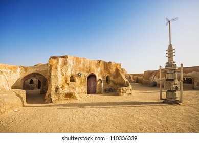 SAHARA, TUNISIA - JUL 10: Abandoned Sets For The Shooting Of The Movie Star Wars In The Sahara Desert On A Background Of Sand Dunes On July 10, 2012 In Sahara, Tunisia