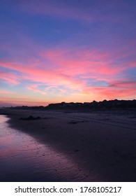 Saharan Dust Cloud Sunset Over The Beach