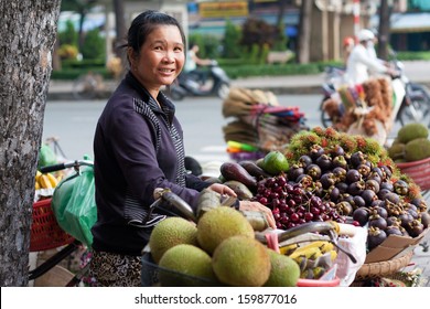 SAI GON, VIET NAM- JULY 21: Street Vendor With Fruit Store On Bicycle , Sai Gon, Viet Nam On July 21, 2013