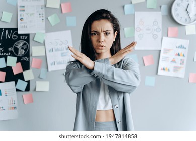 I Said, No! Angry Woman Shows Her Crossed Arms In X Gesture Sign And Looks On Camera. Stop Sign