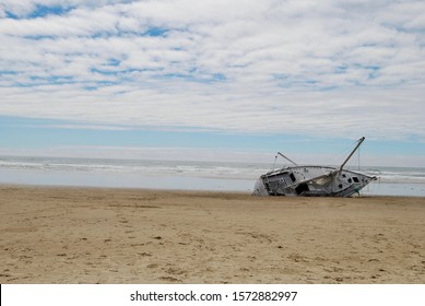 Sail Boat Capsized And Beached